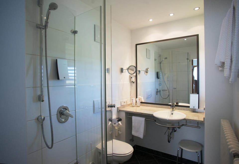 Shower, hair dryer, bathrobes, towels