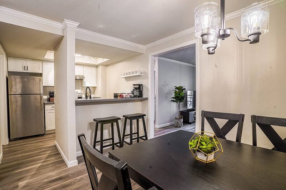 Separate kitchen with breakfast bar and dining area