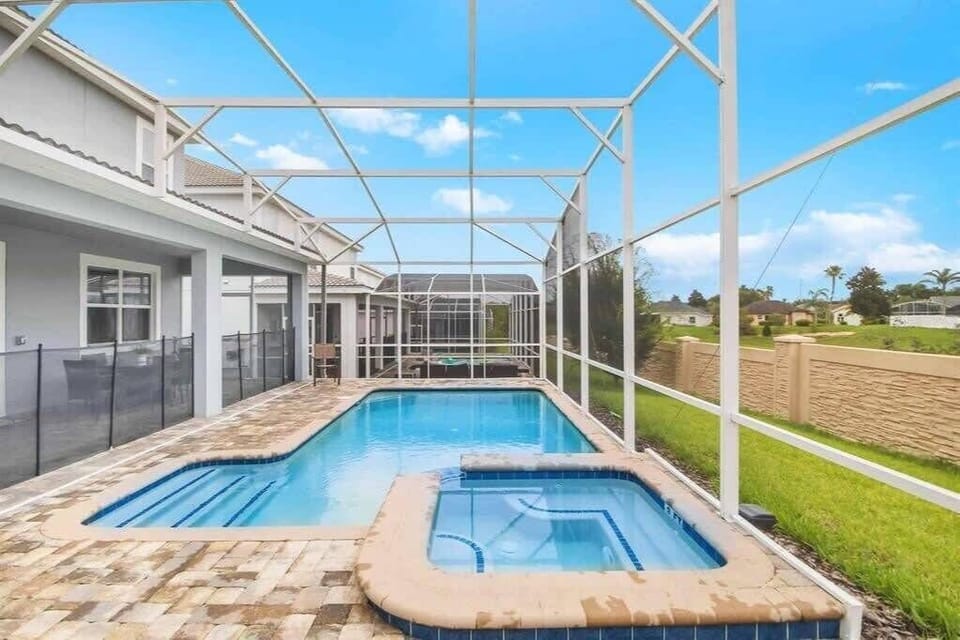 Dive into relaxation with your private pool and hot tub, surrounded by serene views and ample space for ultimate unwinding.