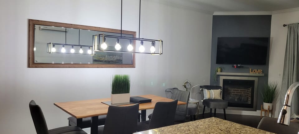 Comfort Condo | Living area | 50-inch TV with cable channels, DVD player