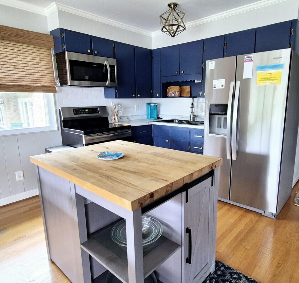 Modern kitchen with essentials for home-cooked meals and gatherings.