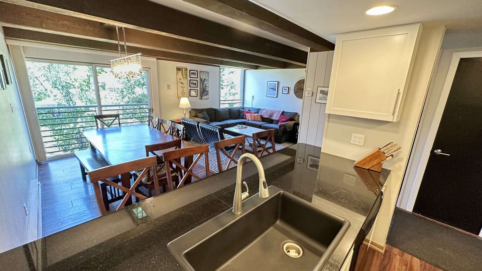 View from kitchen to dining table and west facing sliding door