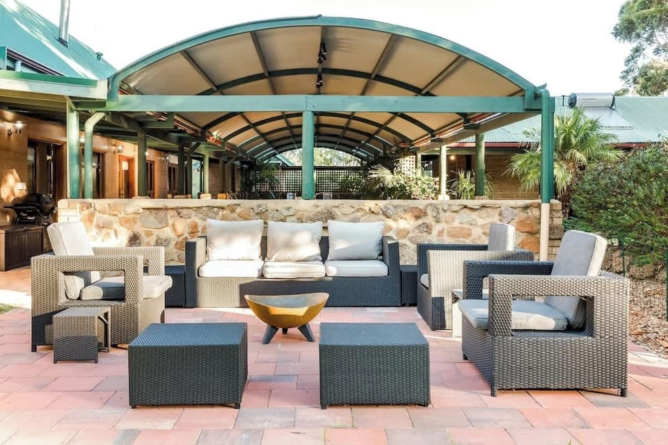 A sprawling, sun-drenched open patio is perfect for your morning coffee or evening chats—surrounded by nature and styled for comfort and connection.