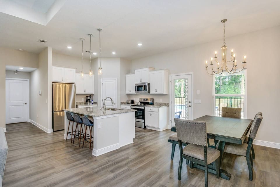 Open Kitchen Equipped With Stainless Steel Appliances