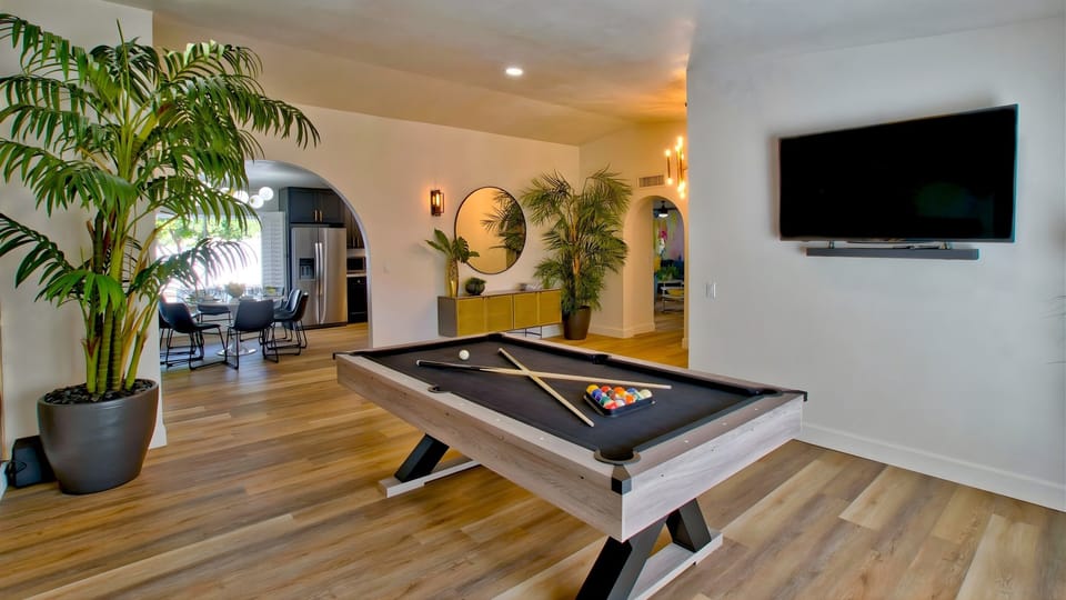 Front room with pool table and TV
