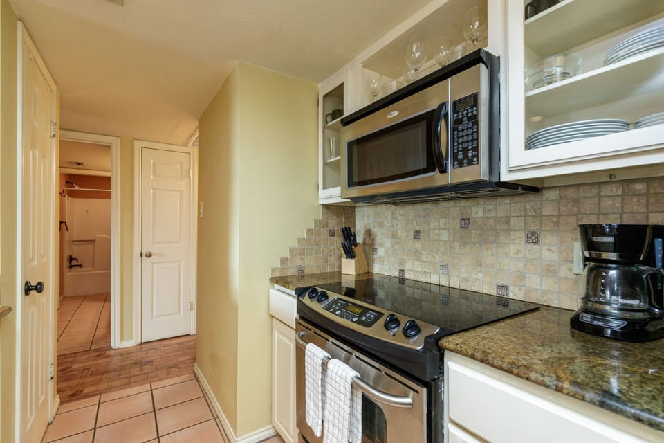 Your fully equipped kitchen awaits with granite counters, stainless appliances, and everything needed to create memorable meals during your stay.