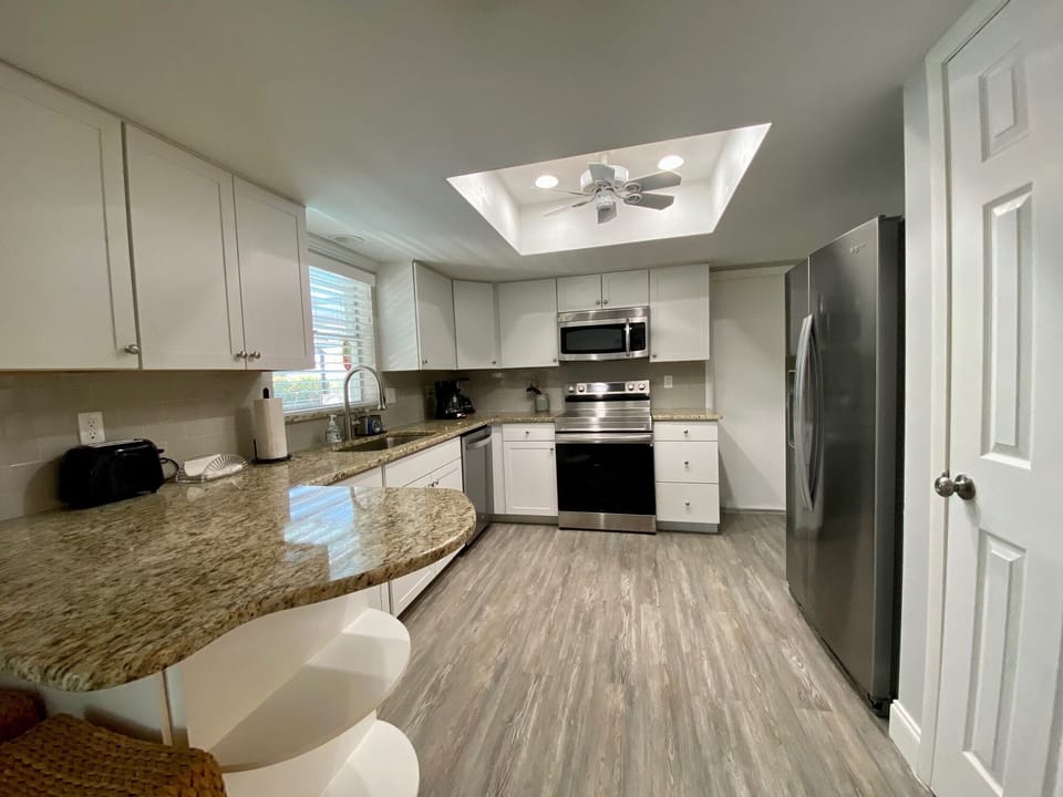 Pantry and plenty of cabinets in this well-equipped kitchen!