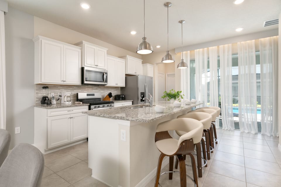 Another view of the fully equipped, beautiful, and spacious kitchen.