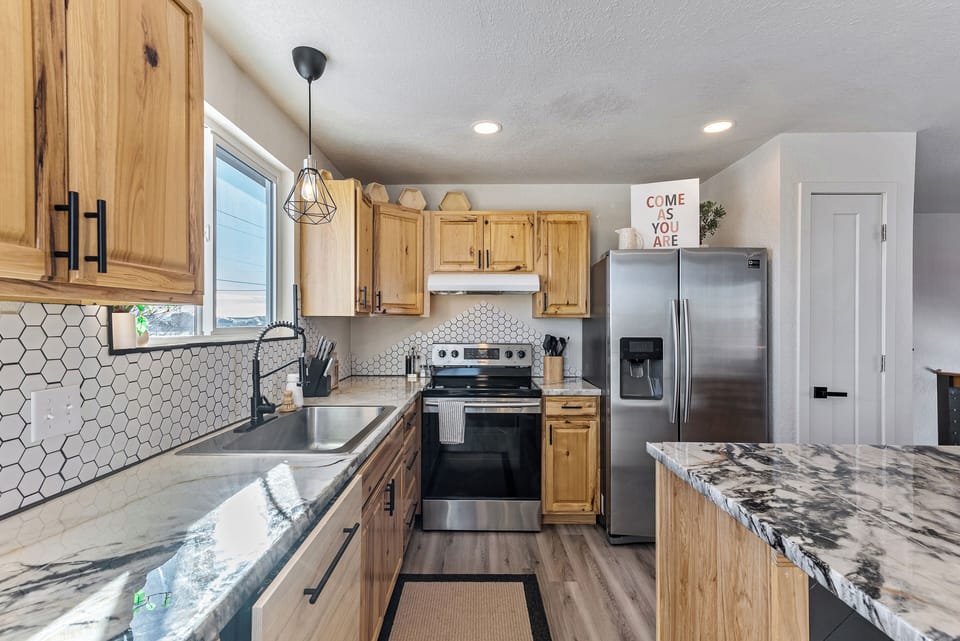 Kitchen with stainless steel appliances.
