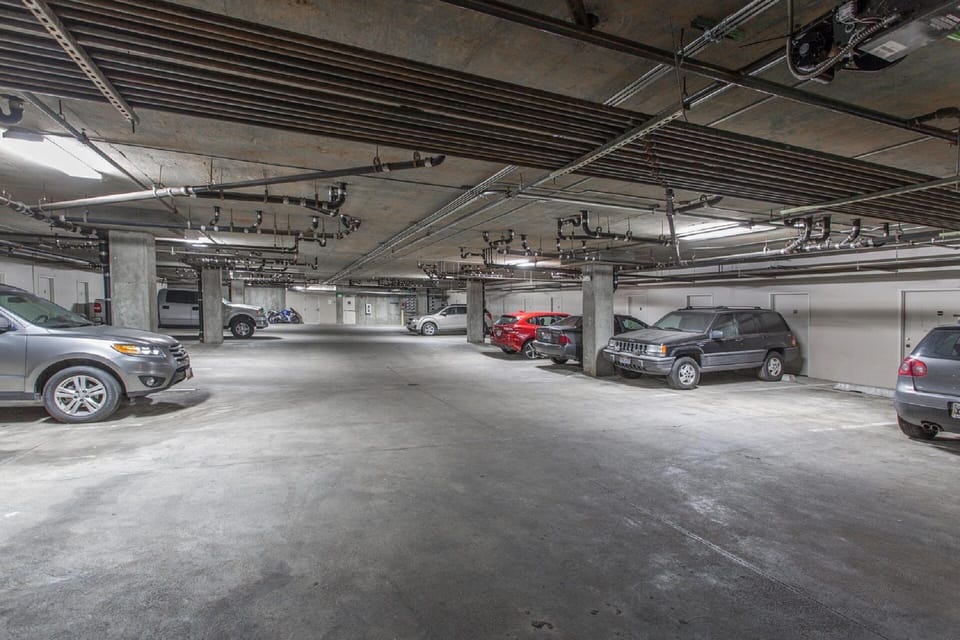 Heated secure garage with one assigned parking spot. Extra parking available.