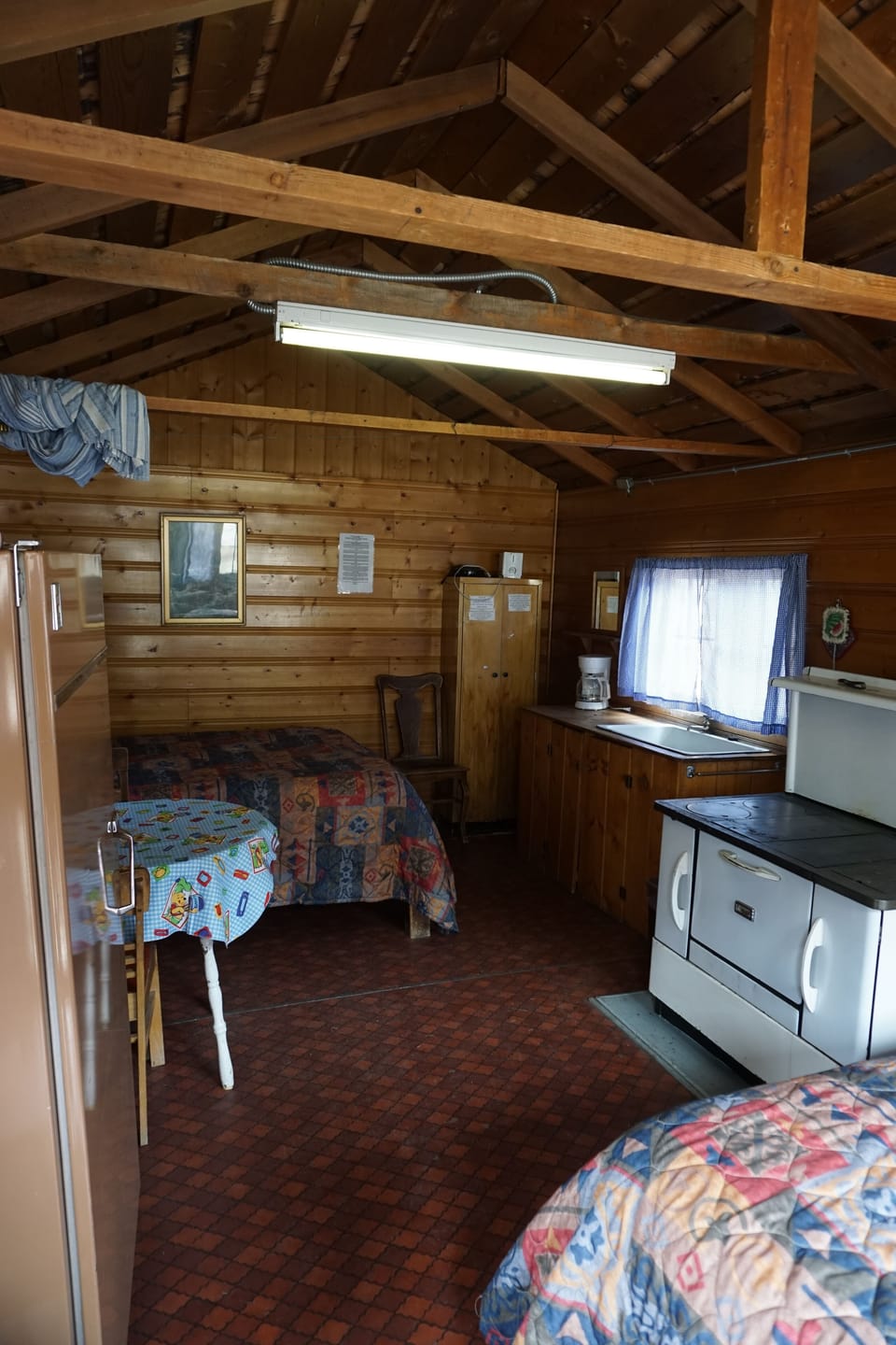 Cabin 2 is a cozy rustic cabin that features a wood-burning stove and two full size beds..