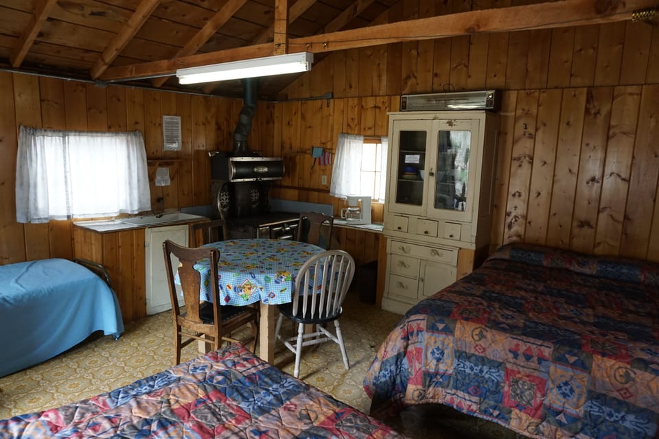 Cabin 6 features two full size beds and a twin cot. (2)