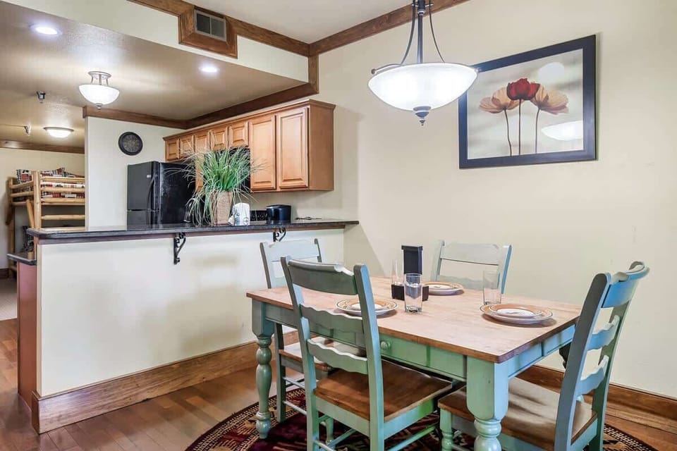 A cozy dining room awaits! Gather around this table with friends and family.