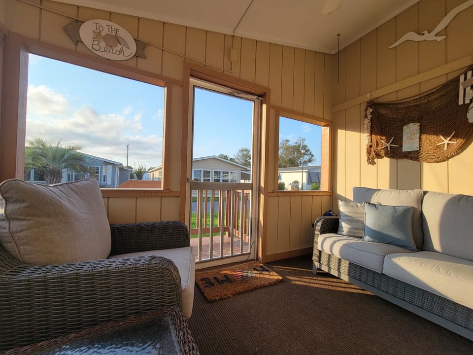 Screened in porch - perfect for sunset relaxing after a day at the beach