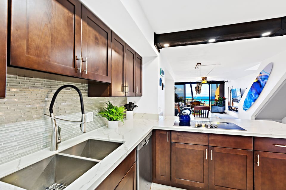 This beautifully designed kitchen features rich wooden cabinetry, top-of-the-line appliances, and a spacious layout for effortless meal preparation and entertaining.
