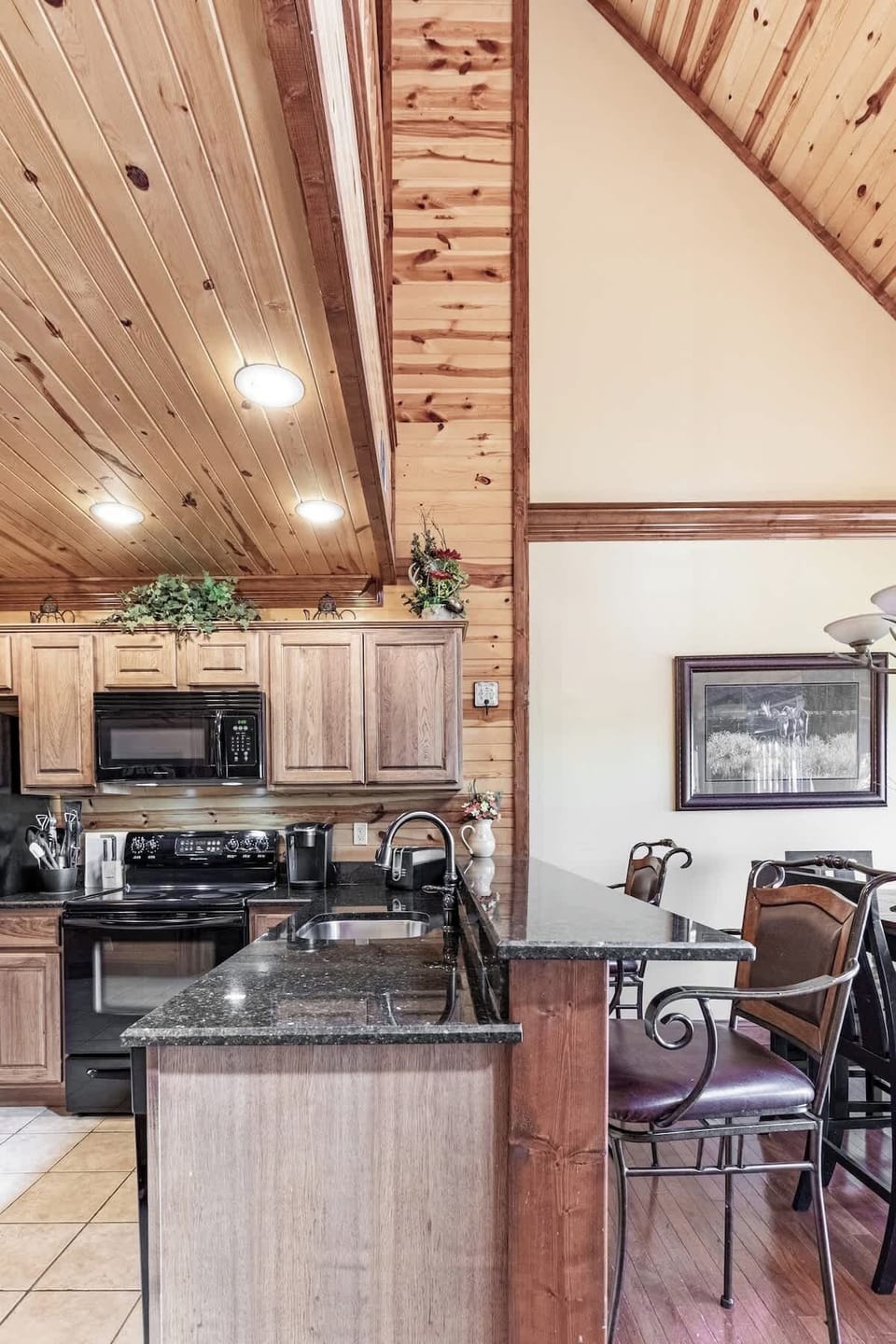 Culinary adventures await in this spacious kitchen with stylish bar seating and sleek finishes!