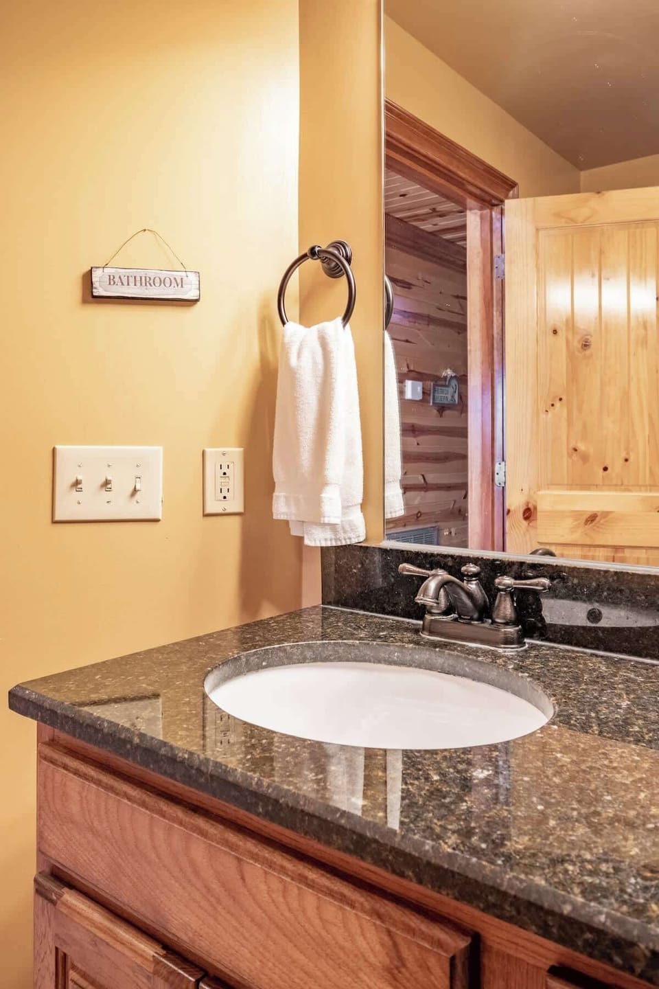 Bright and inviting, with elegant granite countertops and rustic wooden charm!