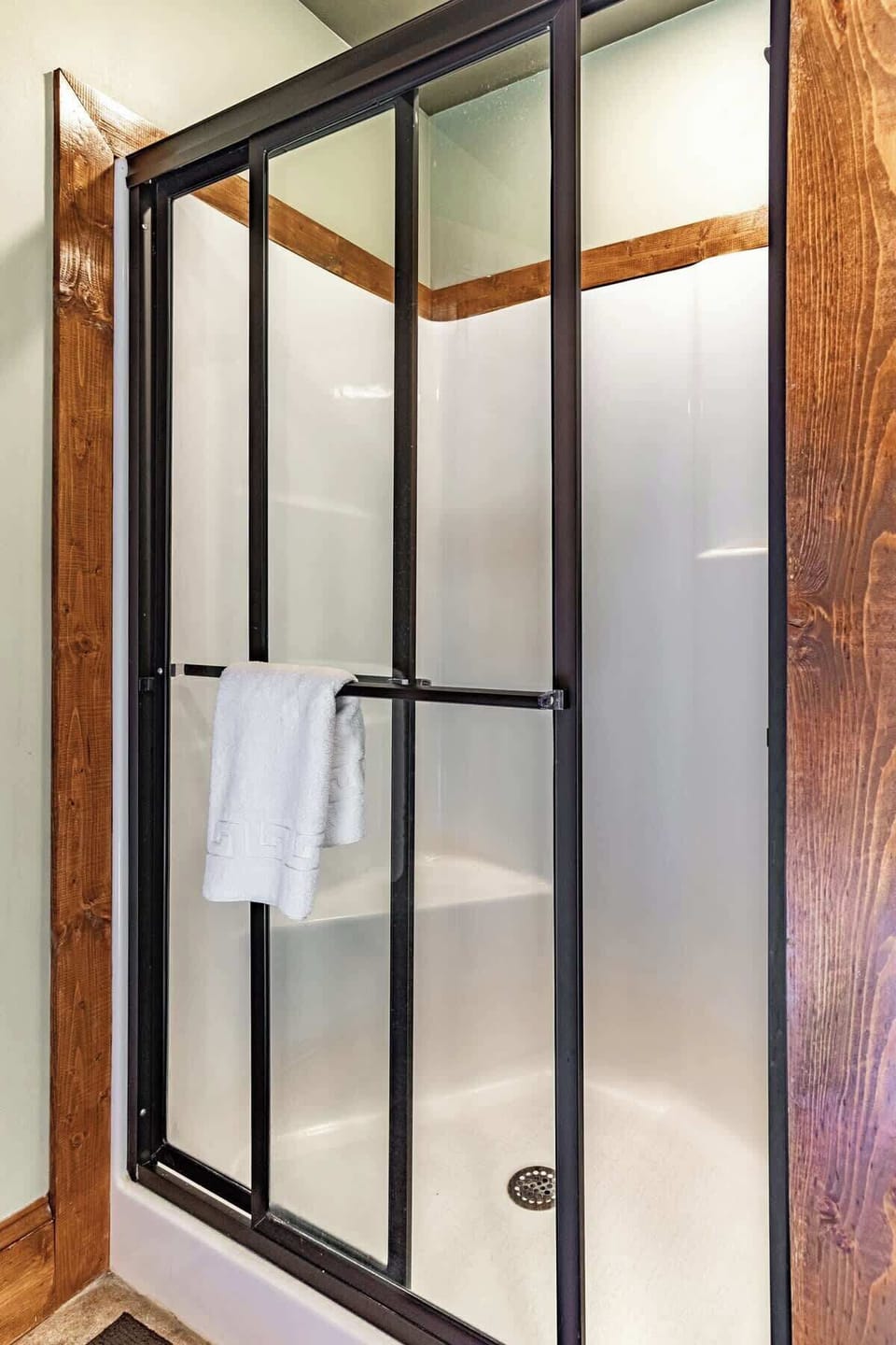 The upstairs walk-in shower with plenty of room for standing or sitting 