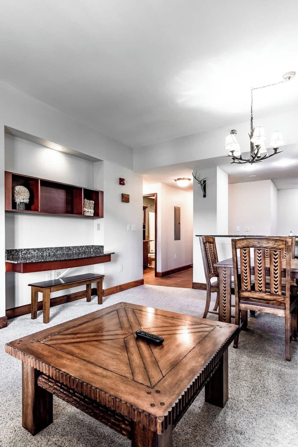 Enter a stylish space with warm wood accents, perfect for gathering and relaxing!