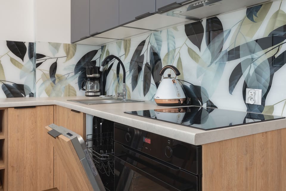 Kitchenette with necessary appliances such as coffee maker and kettle.