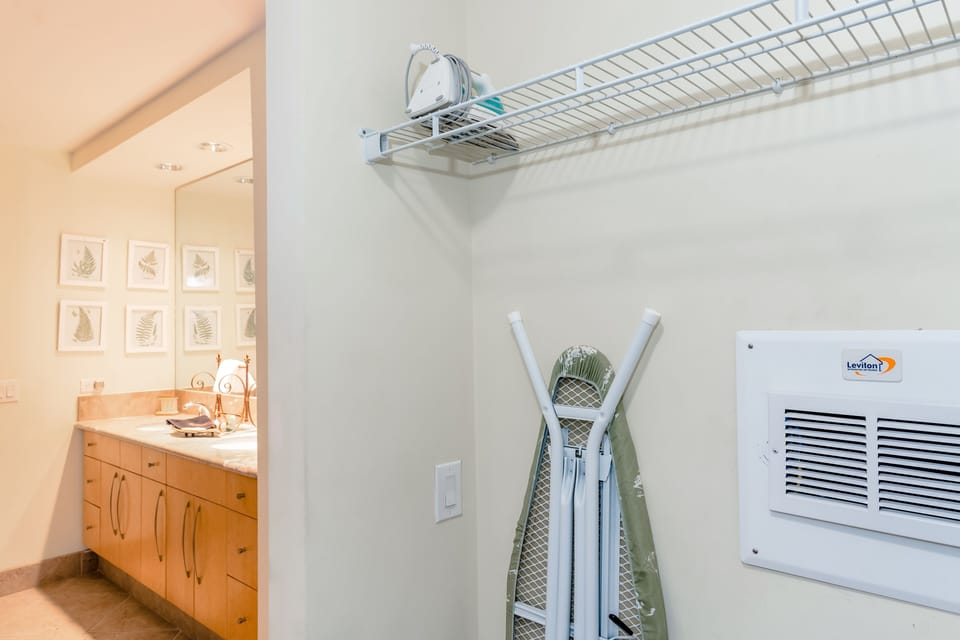 You'll find the iron and ironing board in the walk-in closet. 