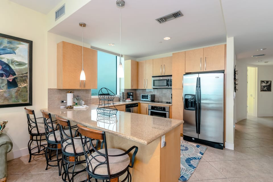 Cooking and entertaining at mealtimes is as breezy as our balconies thanks to a breakfast bar with swivel seating.