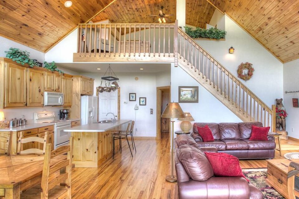 Alternate shot of living room showing stairs to upper loft
