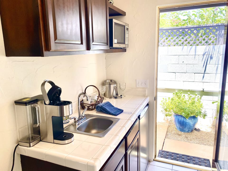 Suite, 1 King Bed, Pool View | Private kitchenette | Fridge, microwave, coffee/tea maker, toaster