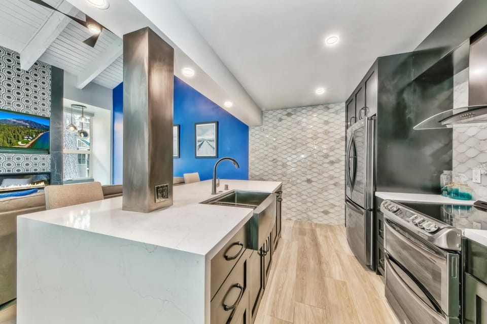 This modern kitchen is a chef's dream. Stocked full of modern appliances and utensils.