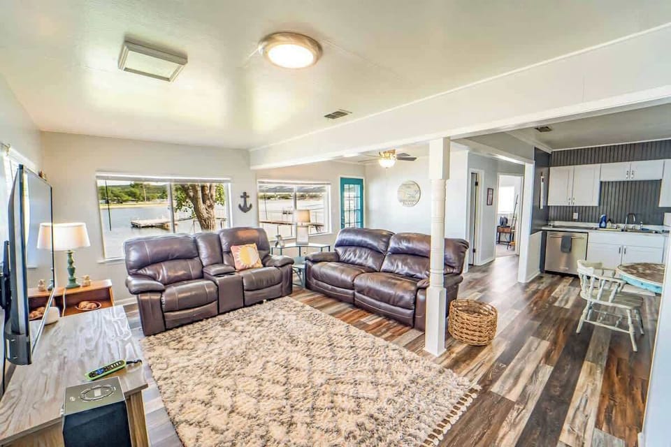 The living room offers an abundance of windows.  You can keep an eye on the lake while watching TV and drinking coffee.
