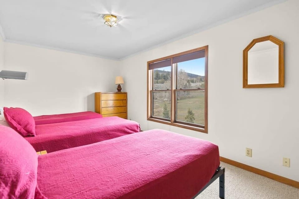 A third bedroom packs an efficient punch with three twin-size beds, a dresser, nightstand, lamps for additional lighting, closet and views of Dillon. Two of the twin beds can also be converted to a split, king bed.