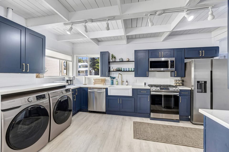 Spacious kitchen layout w/ ample storage, sleek counters & bright open design.