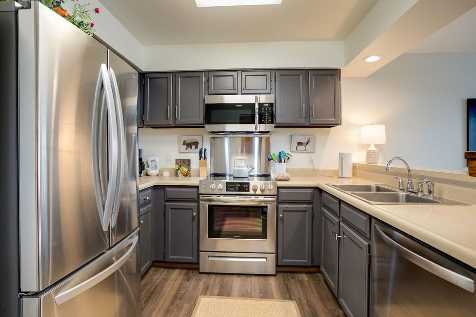 Your modern kitchen features stainless steel appliances and spacious counters for preparing meals during your stay.