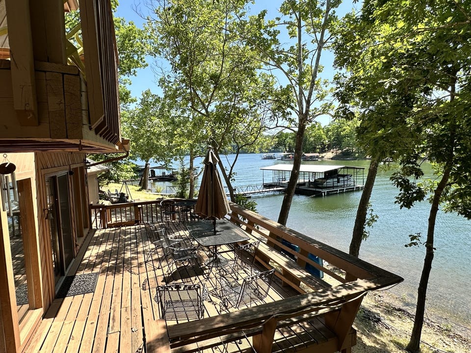 Large Deck off kitchen/Great rm. Go swimming, to dock, firepit, grill or ramp.