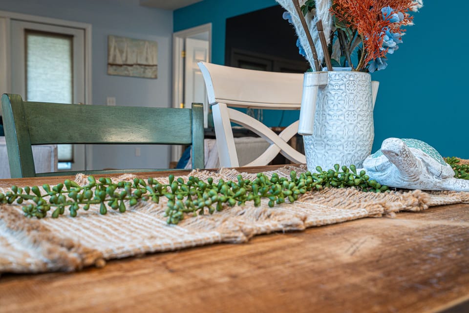 Dining Area: Enjoy meals surrounded by vibrant decor and charming seaside touches!