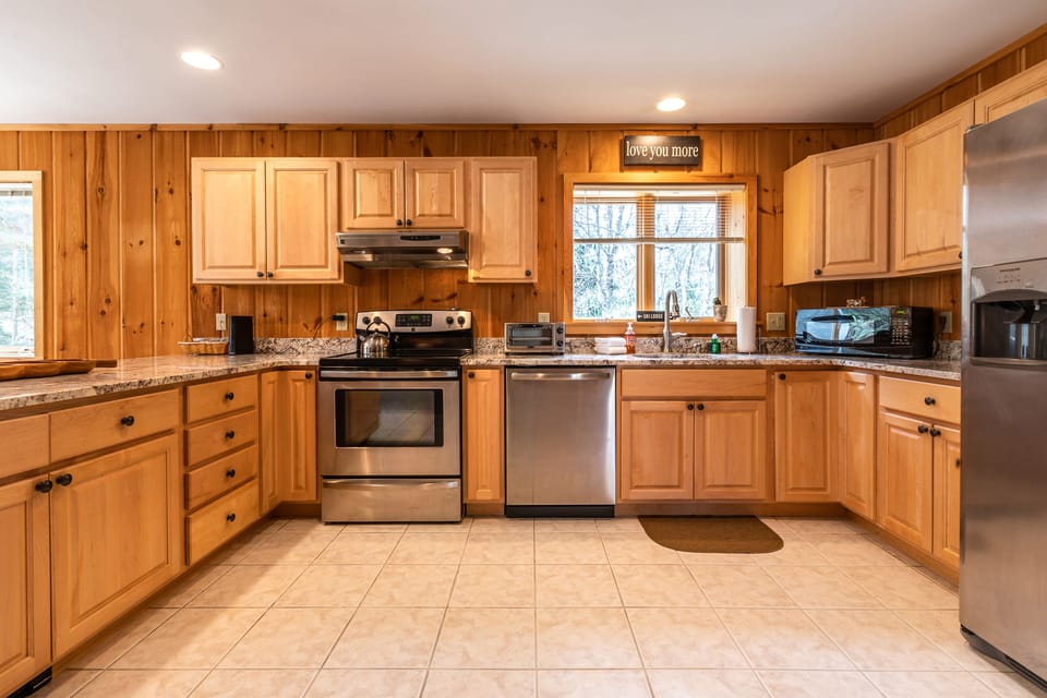 Large kitchen- Fully stocked with pots, pans, and utensils