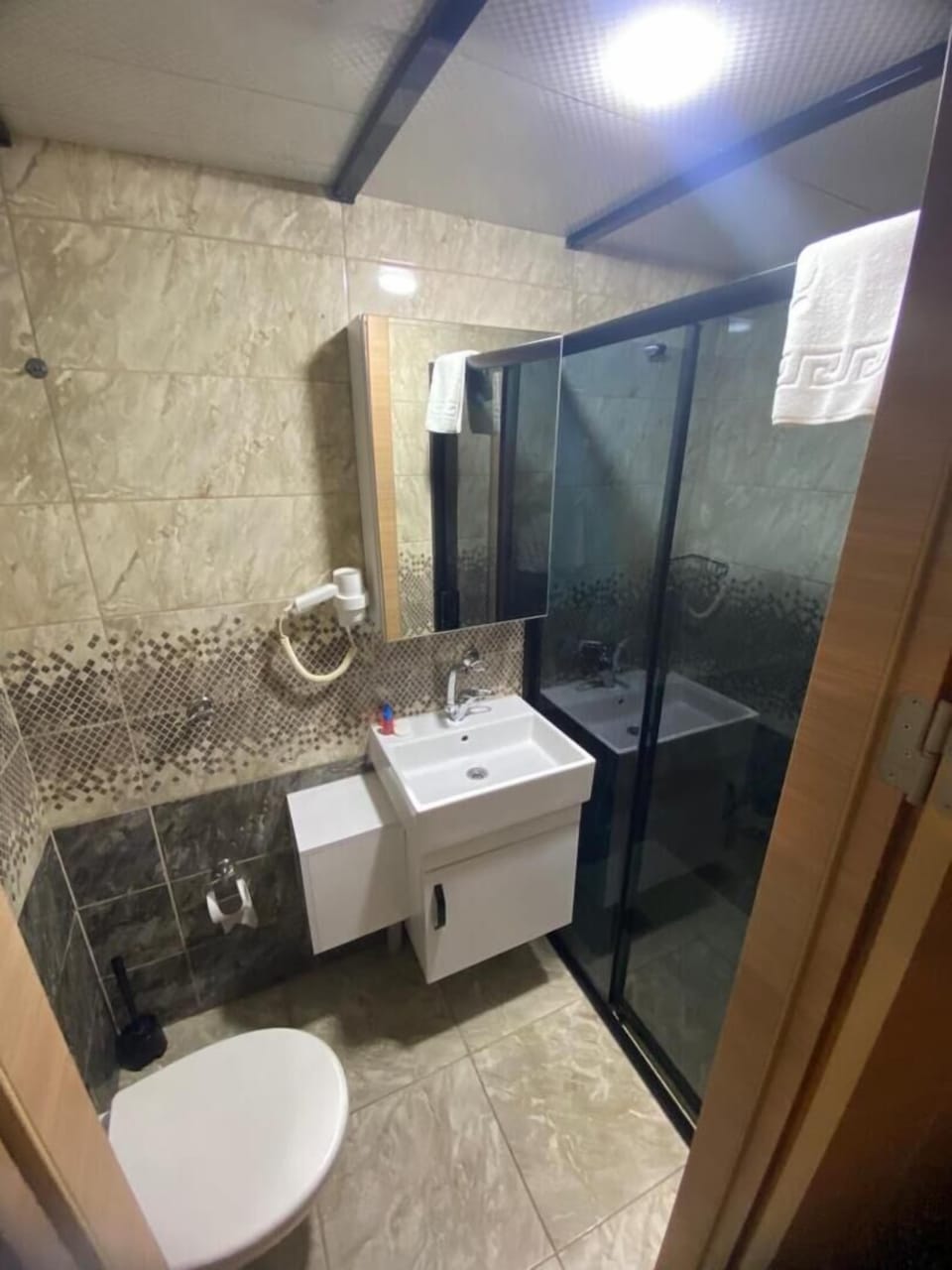 Shower, free toiletries, hair dryer, slippers