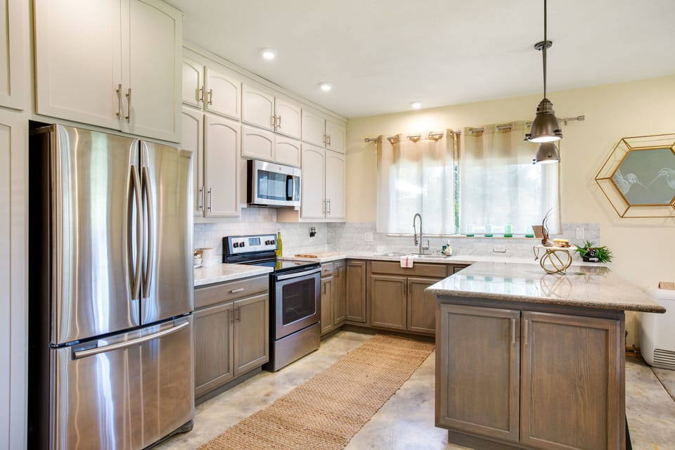 Large kitchen with huge marble island and flooded with light!