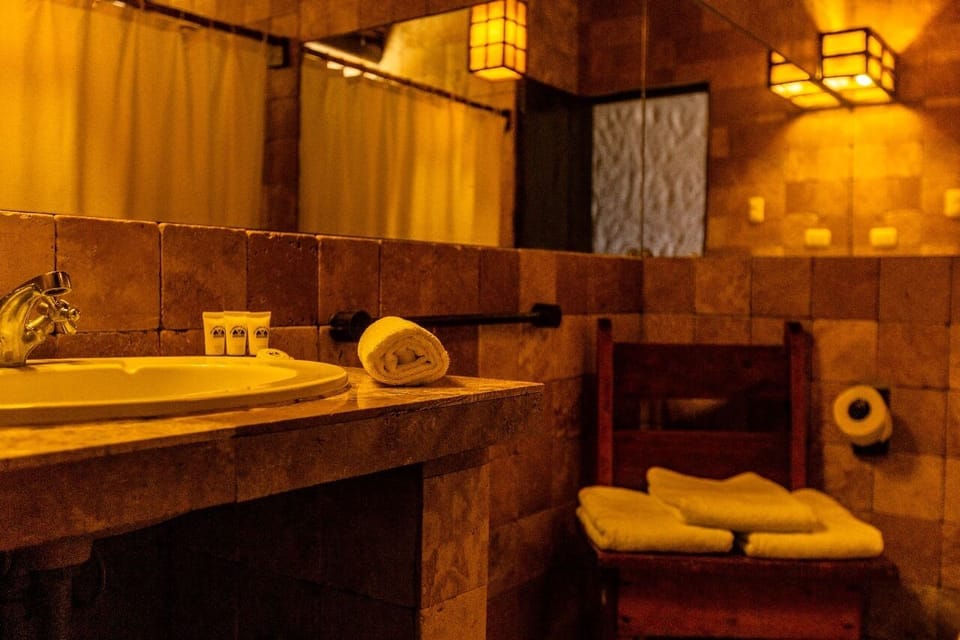 Standard Double Room | Bathroom | Shower, hair dryer (on request), towels, soap