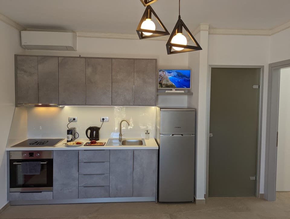 Luxury Apartment | Private kitchen | Full-size fridge, oven, espresso maker, coffee/tea maker
