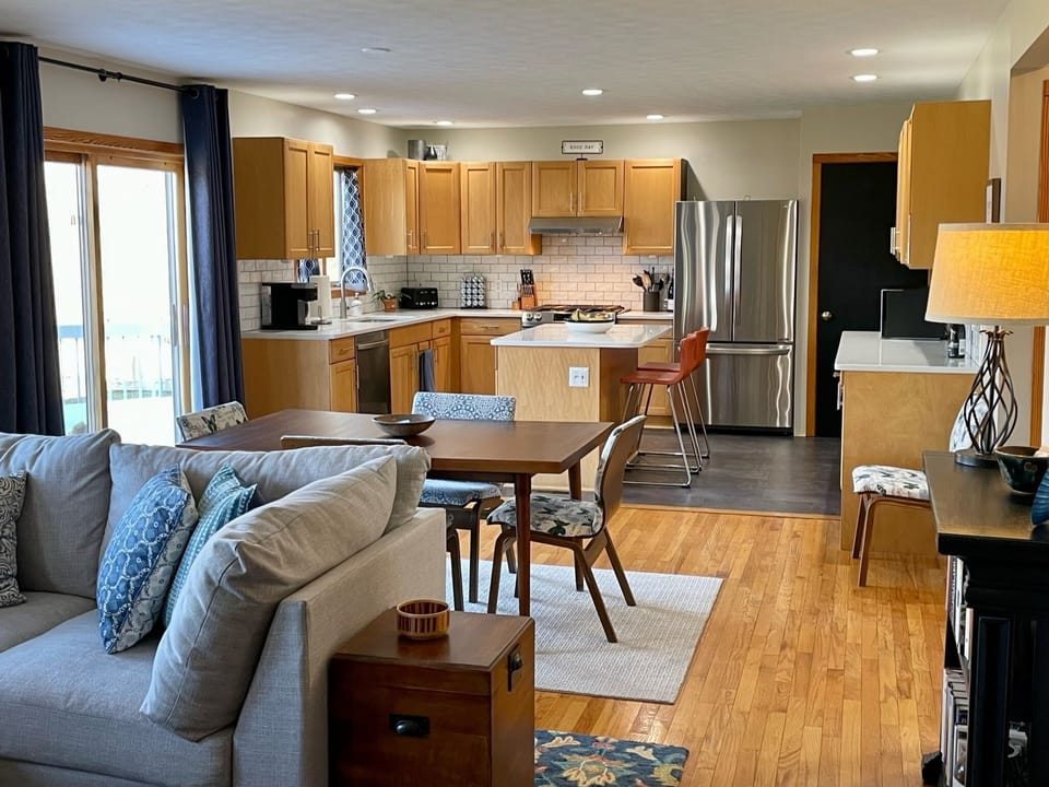 Great room, looking from the family room through the dining area to the kitchen.