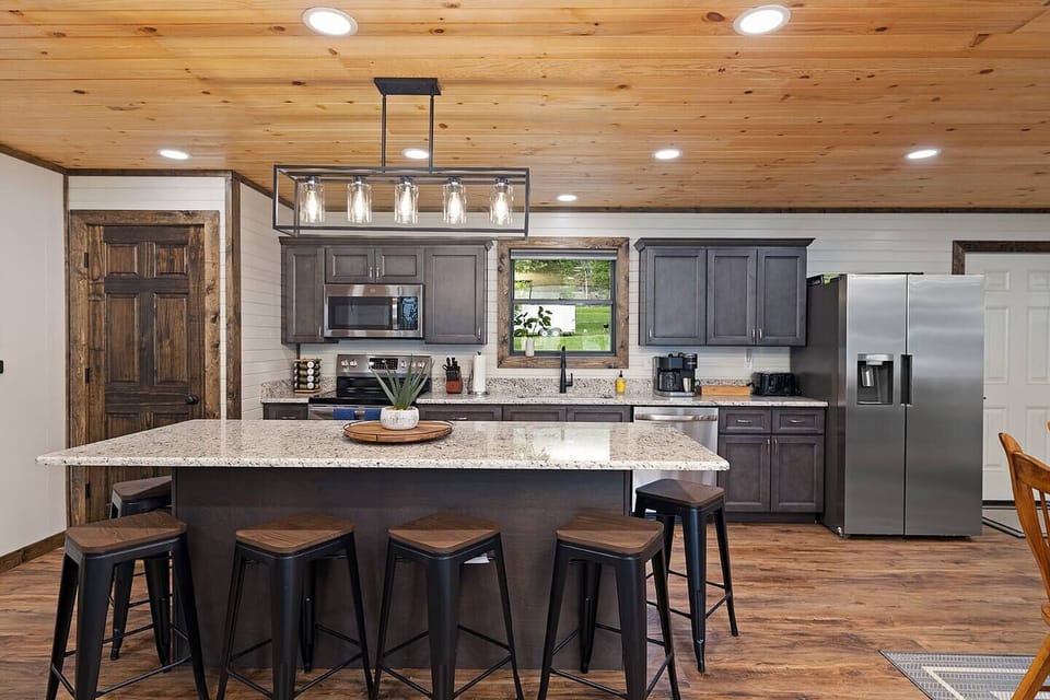 New modern kitchen! Huge island, granite countertops, and stainless steal appliances.