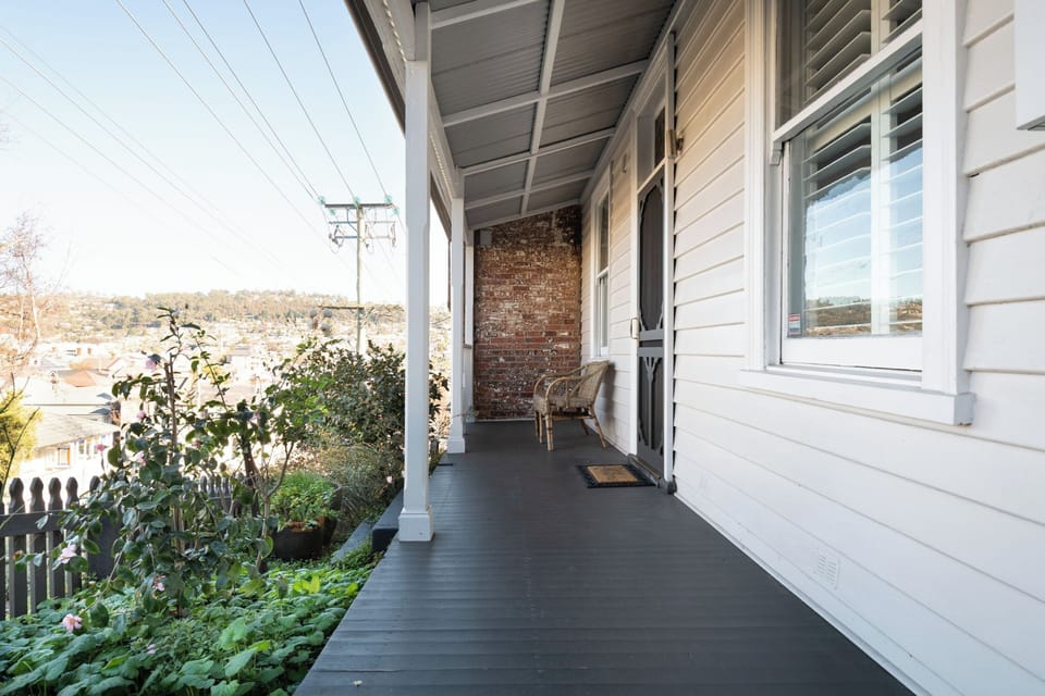 Welcoming porch showcasing magnificent views and the homes stunning features