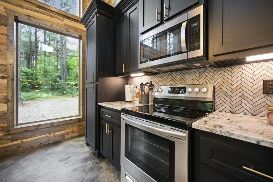 Stainless steel appliances and granite countertops.