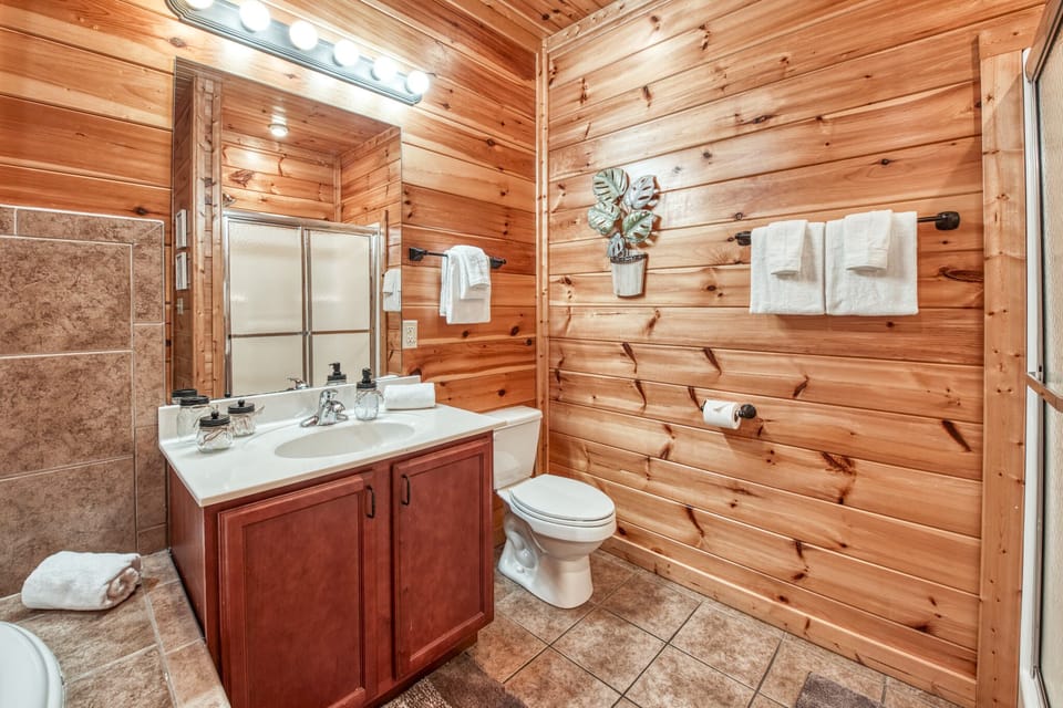 Downstairs bathroom with shower and jetted heart shaped tub