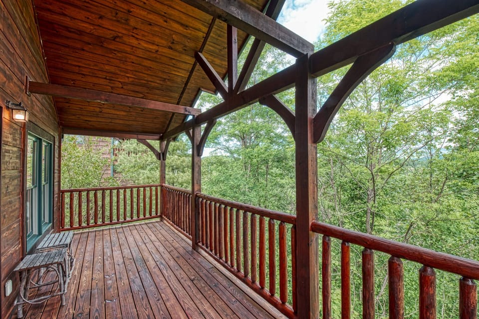 deck with greenery and mountain views