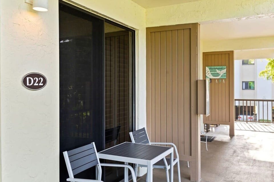 Entrance and balcony overlooking grounds and heated pool