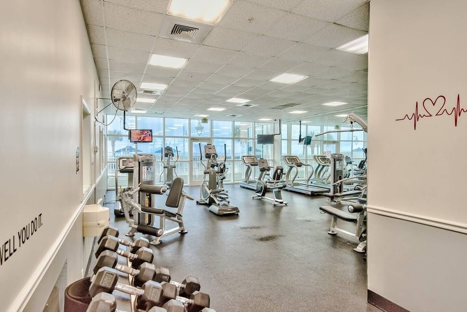 Large fitness center at Majestic Sun with Pool and Gulf view