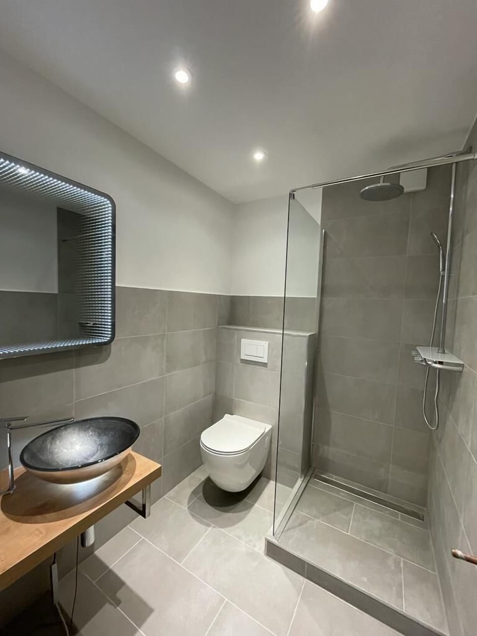 Shower, rainfall showerhead, hair dryer, towels