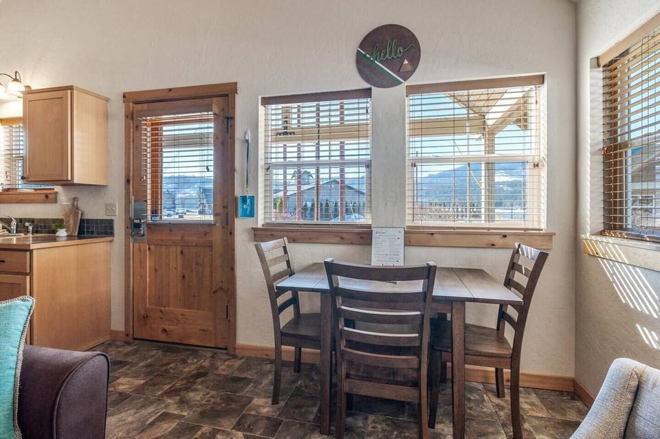 Quaint dining area with seating for three.